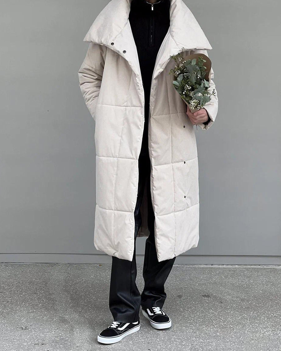 Woman in a long quilted belted coat