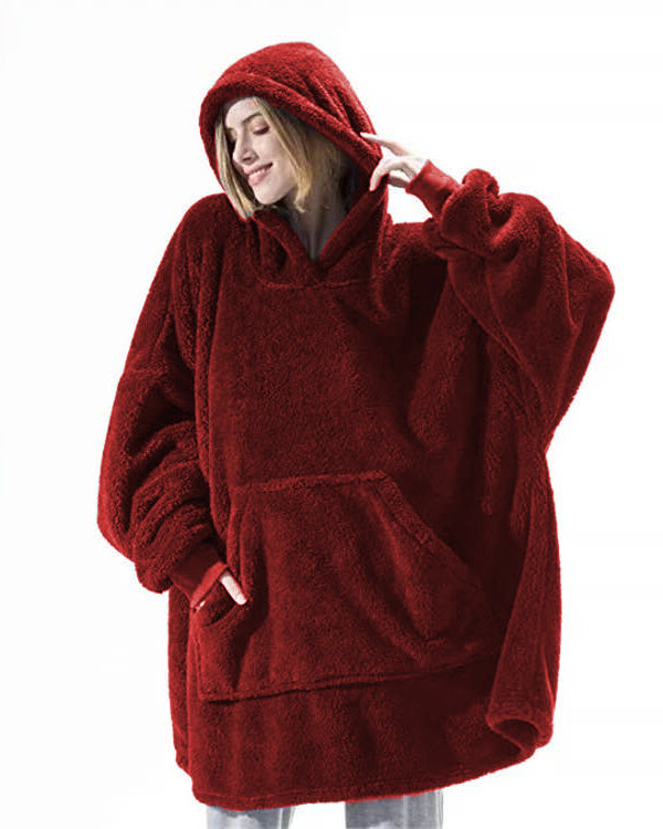 Person wearing oversized plush blanket hoodie