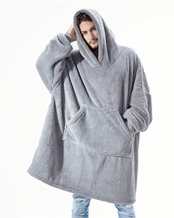 Person wearing oversized plush blanket hoodie