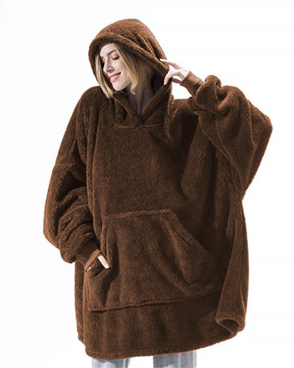 Person wearing oversized plush blanket hoodie