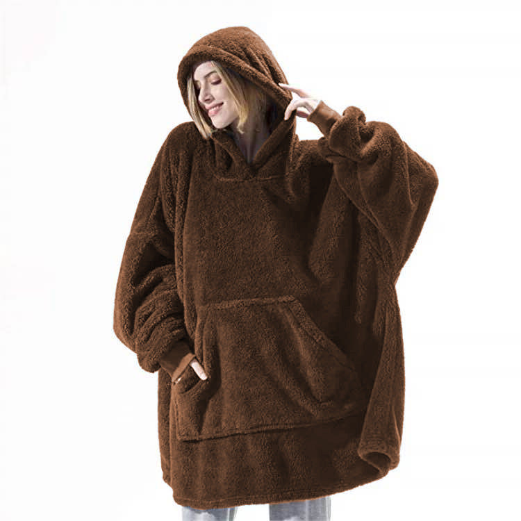 Person wearing oversized plush blanket hoodie