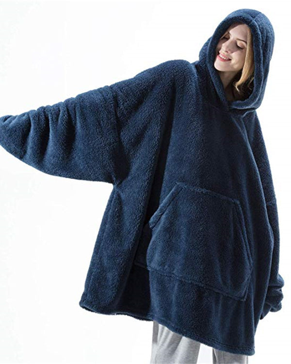 Person wearing oversized plush blanket hoodie