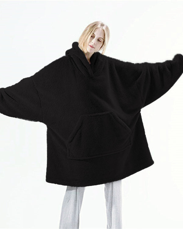 Person wearing oversized plush blanket hoodie