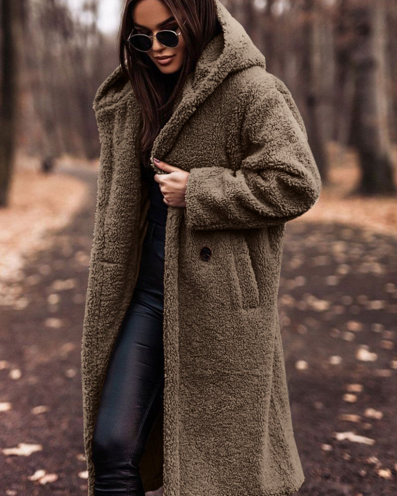 Woman in long hooded teddy coat