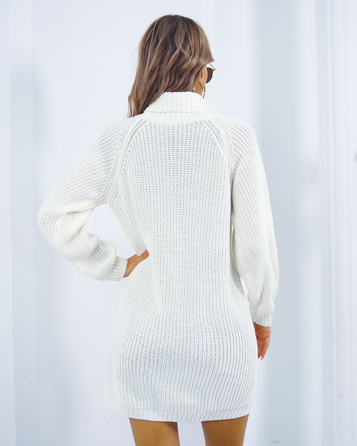 Woman in turtleneck sweater dress
