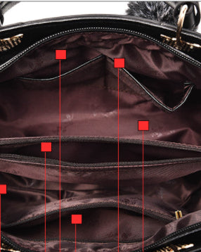 Colorblock handbag with pom-pom charm