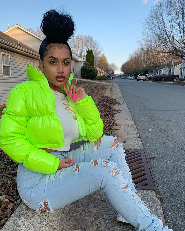 Woman in a glossy cropped puffer jacket