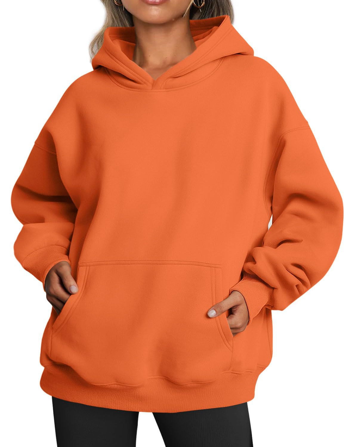 Woman wearing oversized fleece hoodie
