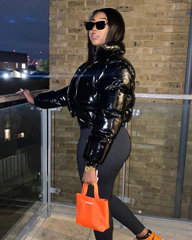 Woman in a glossy cropped puffer jacket