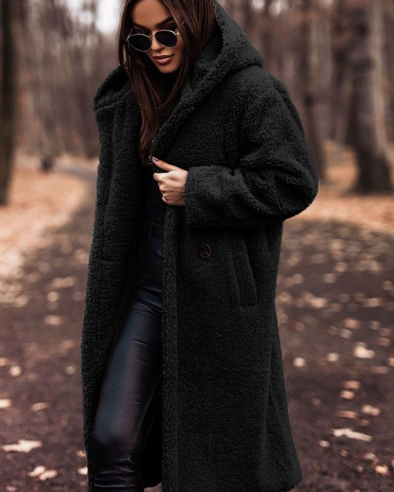Woman in long hooded teddy coat
