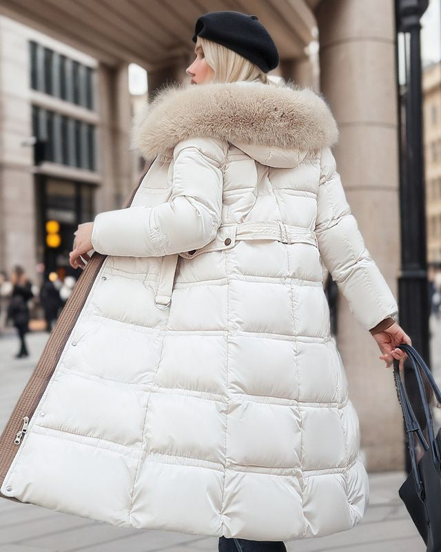 Woman in a long parka with fur hood