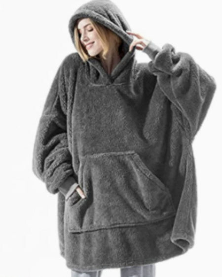Person wearing oversized plush blanket hoodie