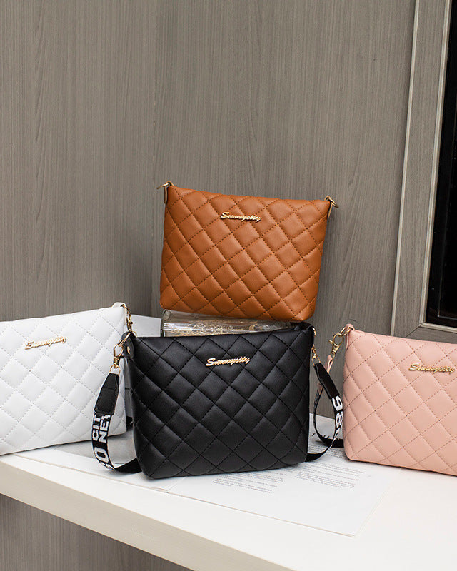 Black quilted crossbody bag with wide strap