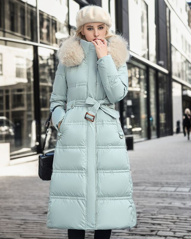 Woman in a long parka with fur hood