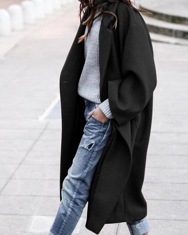 Woman in long oversized lapel coat
