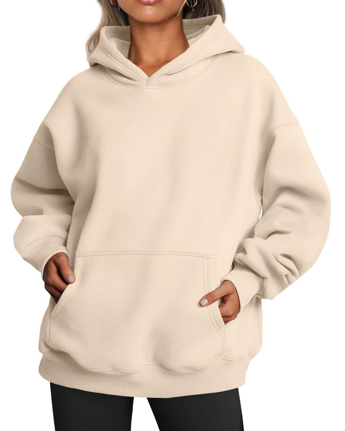 Woman wearing oversized fleece hoodie