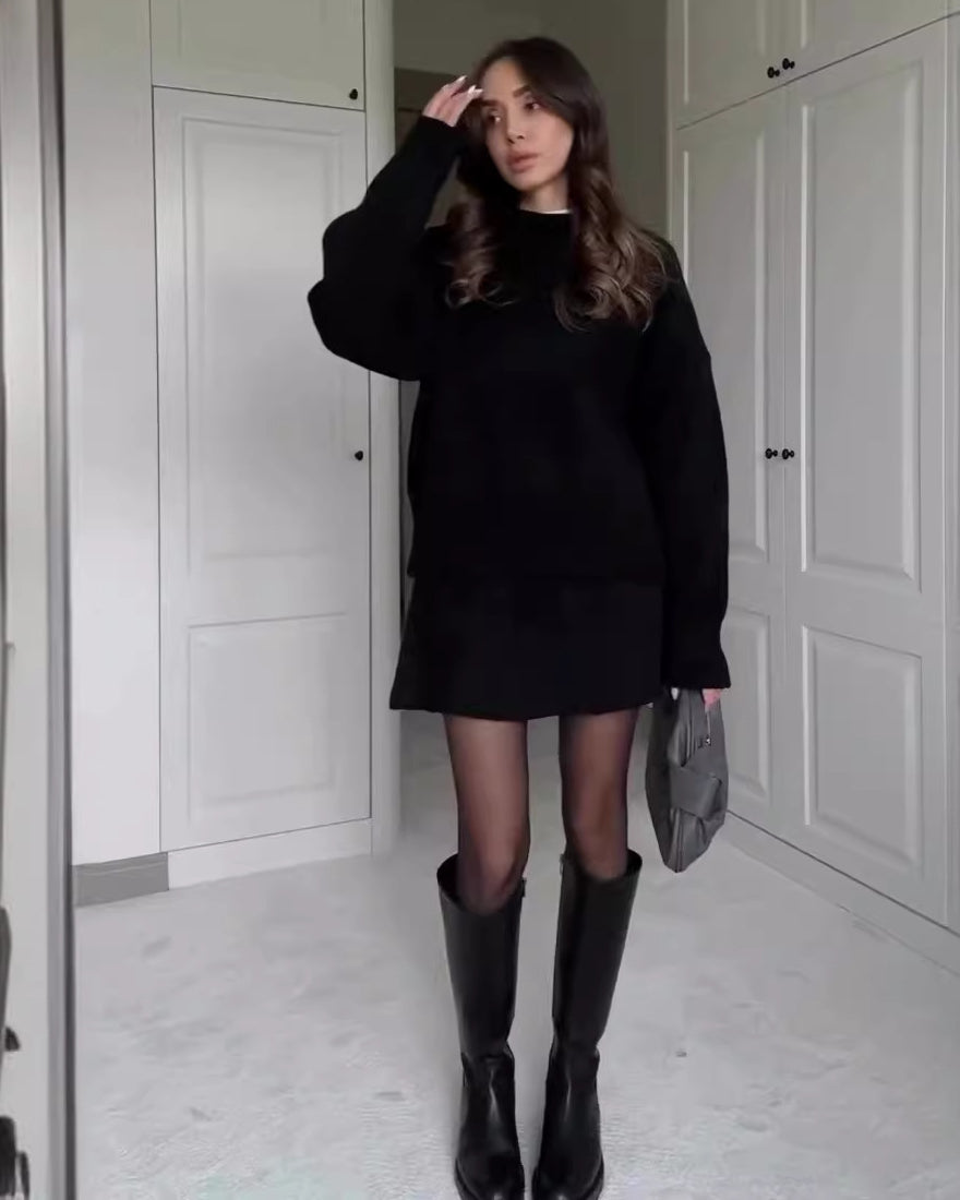 Woman in matching knit sweater and mini skirt set