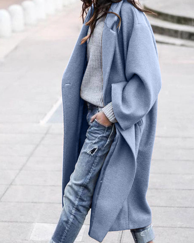 Woman in long oversized lapel coat