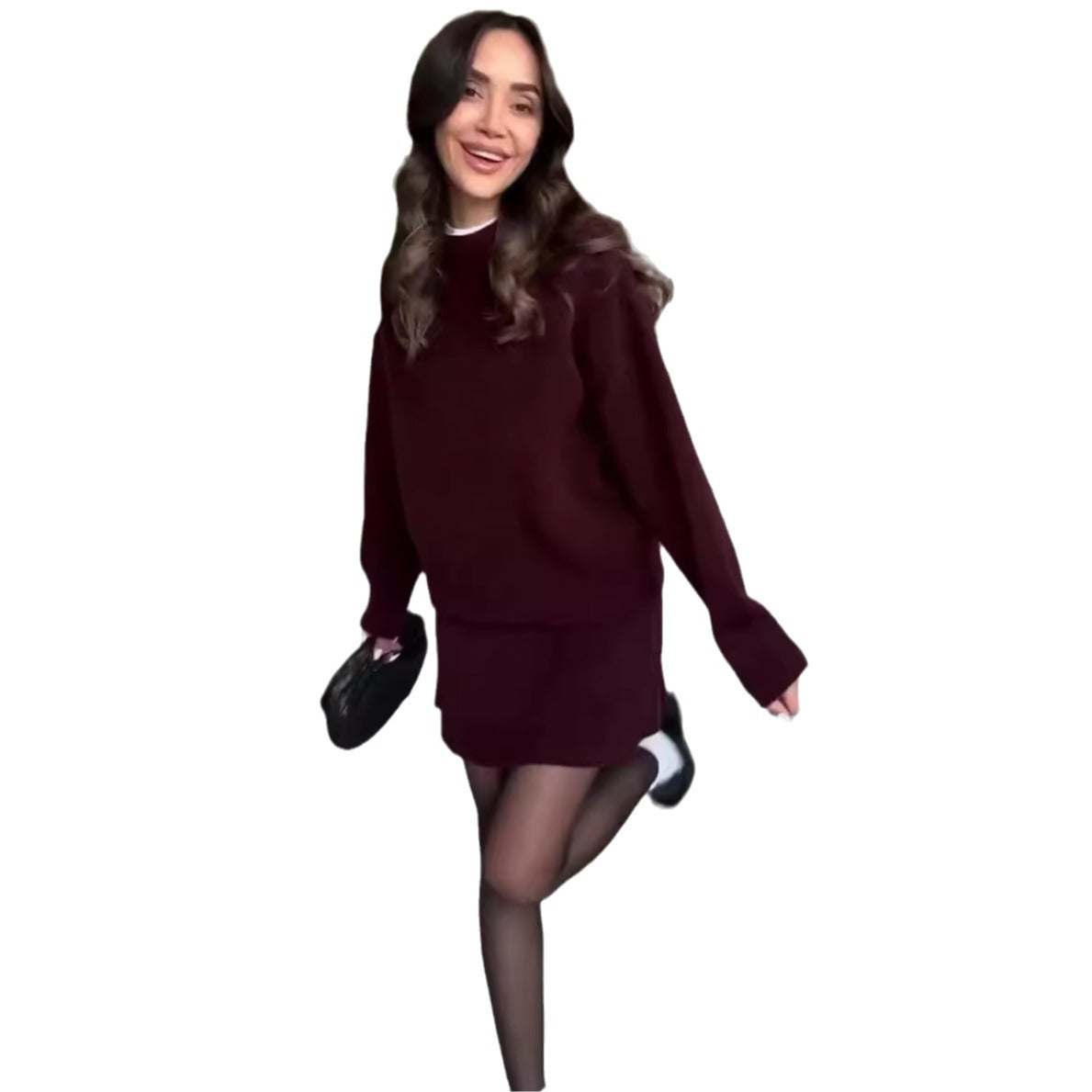 Woman in matching knit sweater and mini skirt set