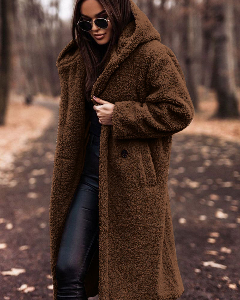 Woman in long hooded teddy coat