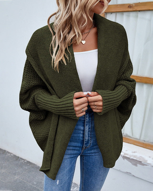 Woman in oversized batwing knit cardigan