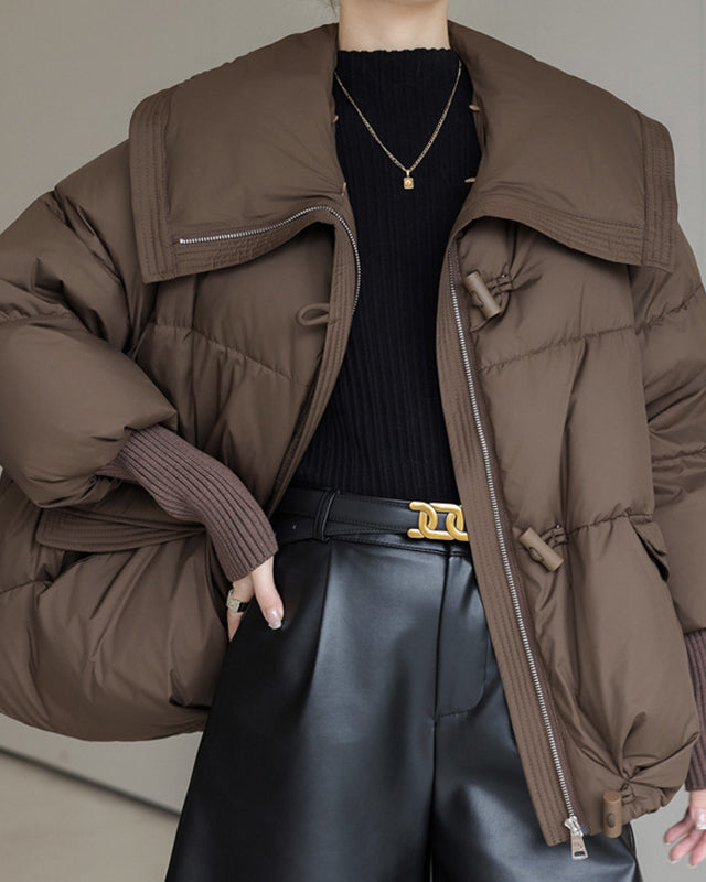 Woman in short puffer jacket with fur collar