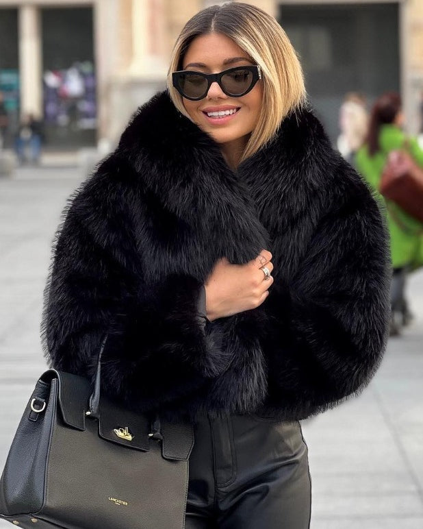 Woman in cropped fluffy faux fur jacket