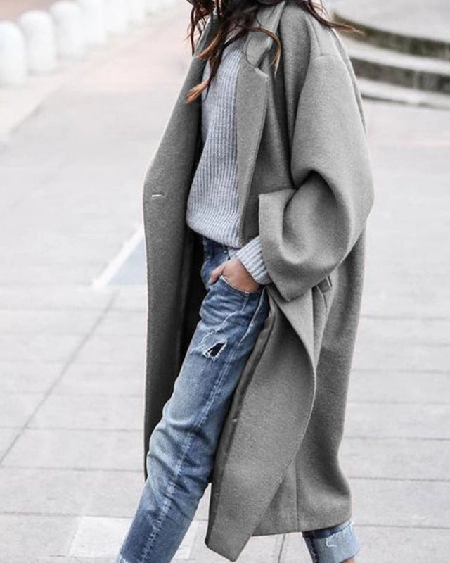Woman in long oversized lapel coat