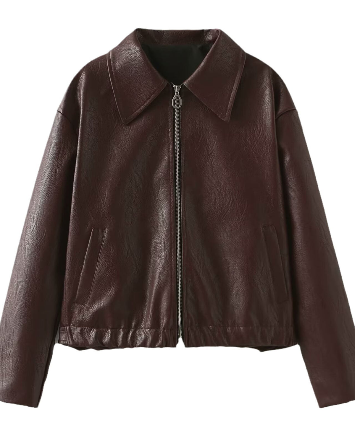 Woman in a cropped burgundy leather jacket