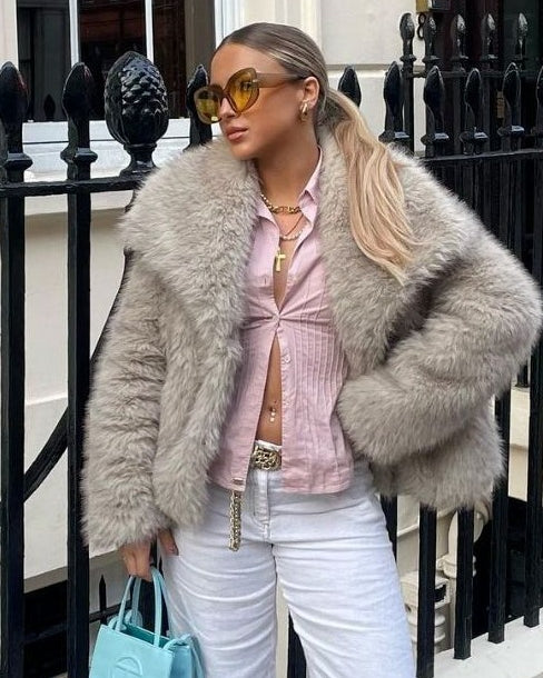 Woman in cropped fluffy faux fur jacket
