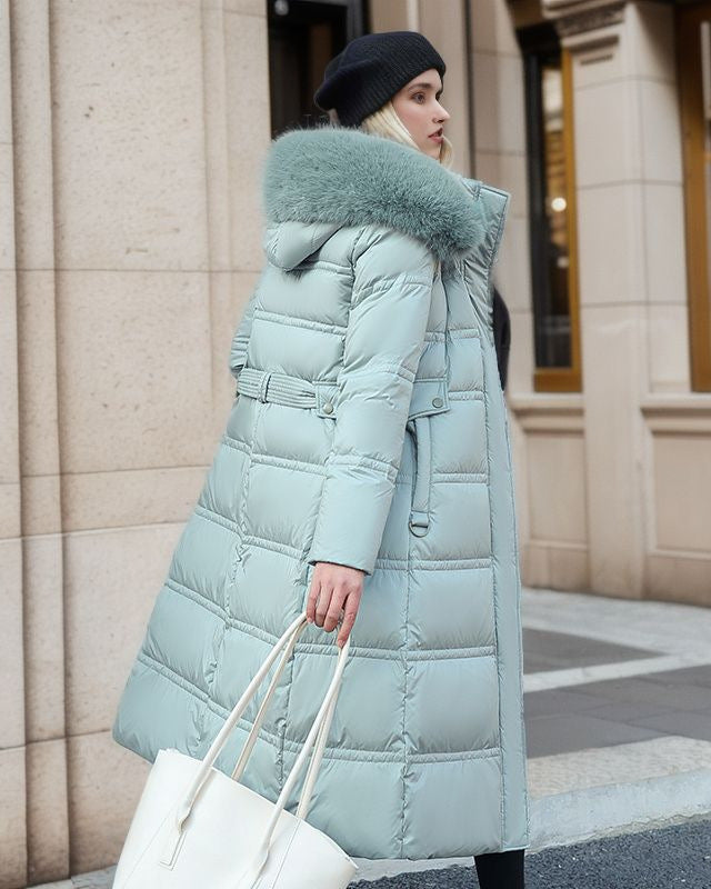 Woman in a long parka with fur hood