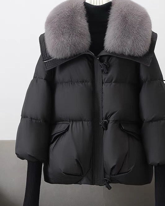 Woman in short puffer jacket with fur collar