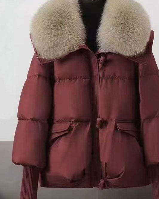 Woman in short puffer jacket with fur collar