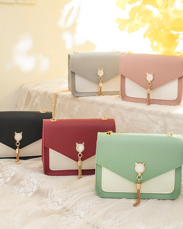 Small square crossbody bag with cat clasp