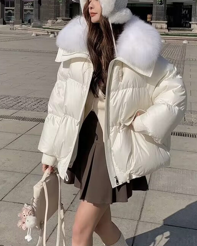 Woman in short puffer jacket with fur collar