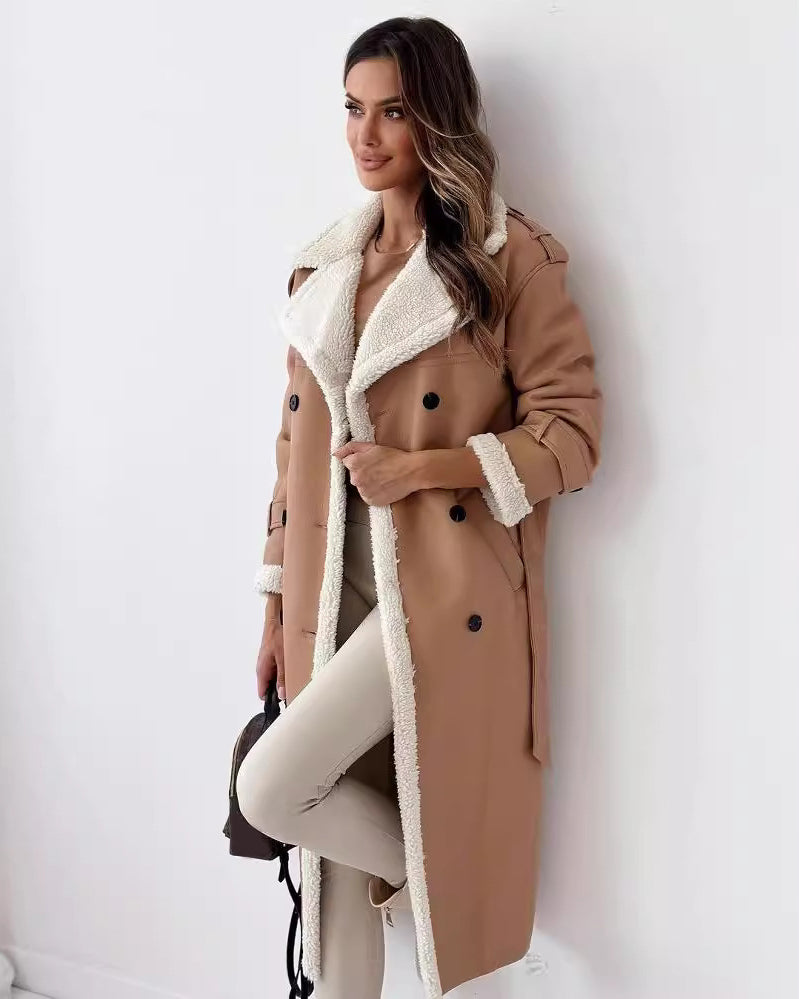 Woman in a belted faux shearling coat