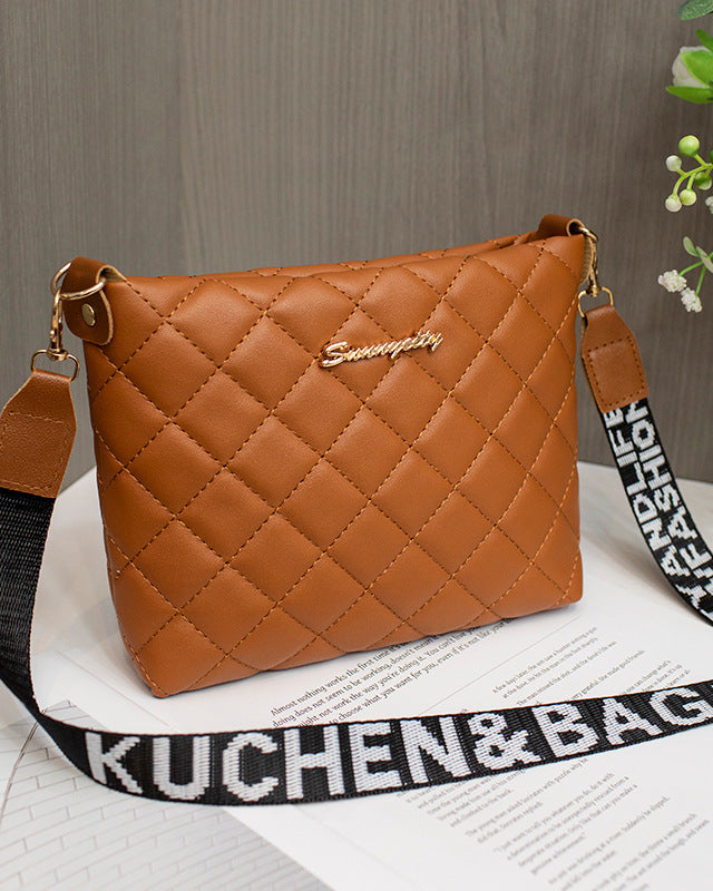 Black quilted crossbody bag with wide strap