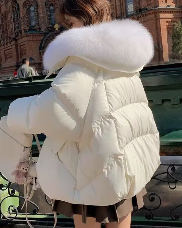 Woman in short puffer jacket with fur collar