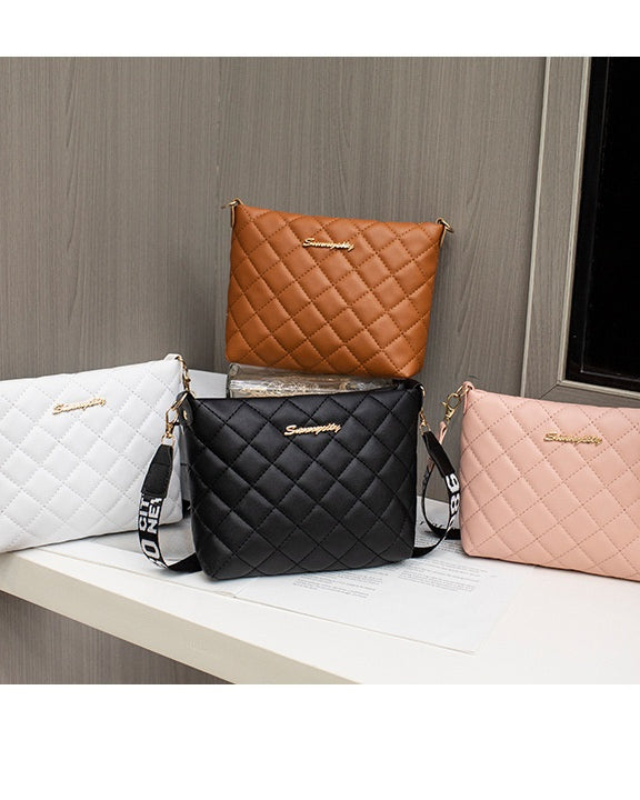 Black quilted crossbody bag with wide strap
