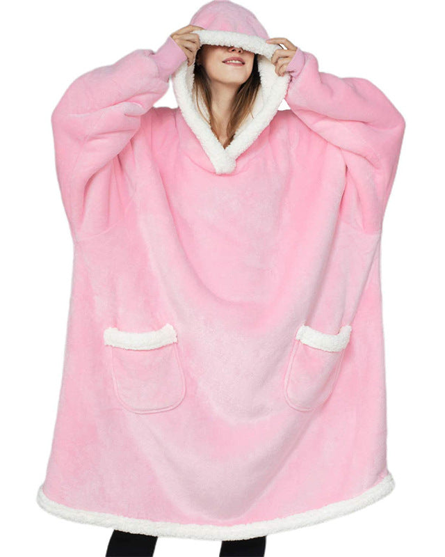 Oversized sherpa hoodie blanket on the couch