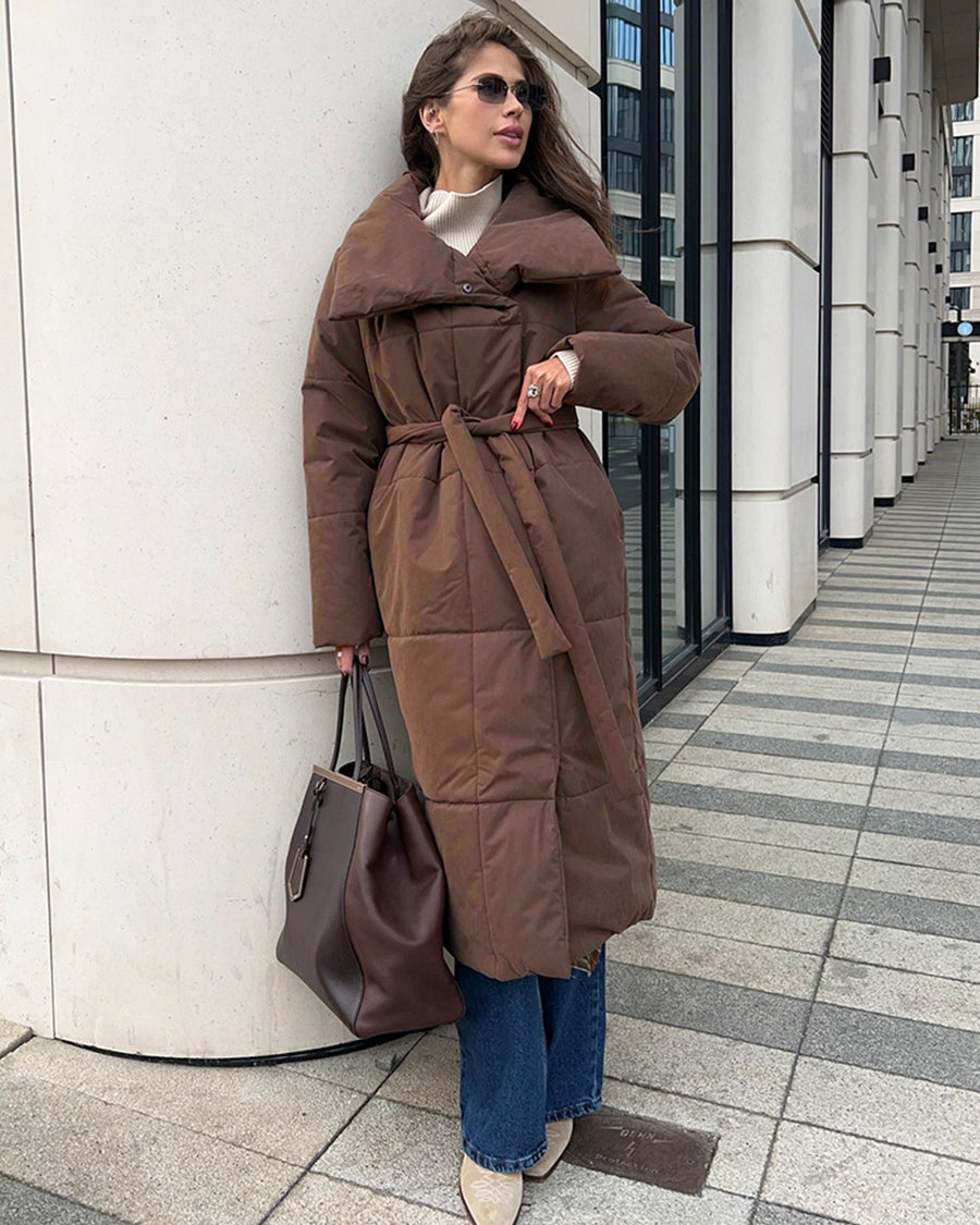 Woman in a long quilted belted coat
