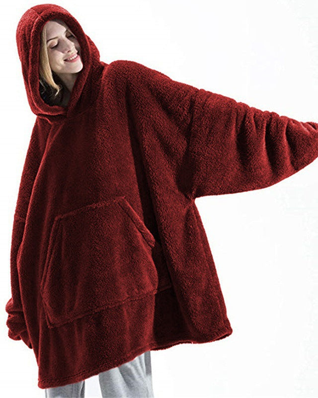 Person wearing oversized plush blanket hoodie
