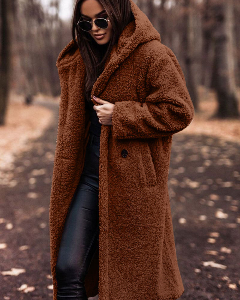 Woman in long hooded teddy coat