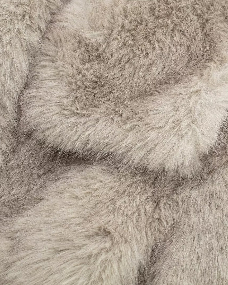 Woman in cropped fluffy faux fur jacket