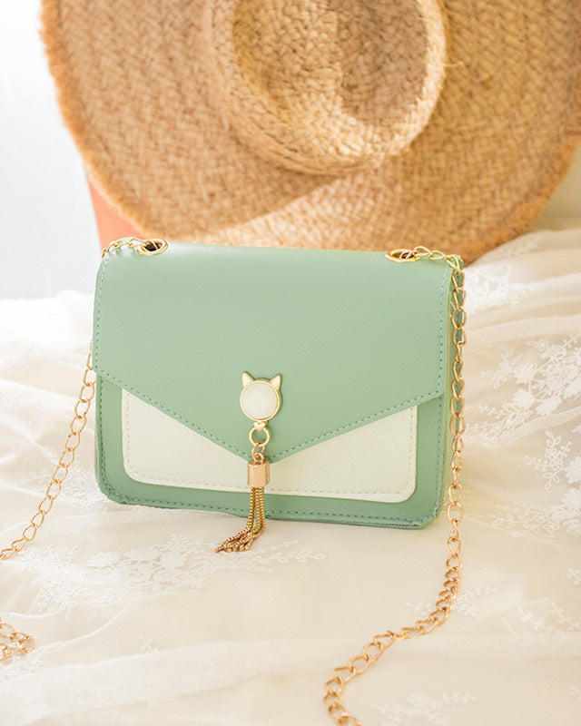 Small square crossbody bag with cat clasp
