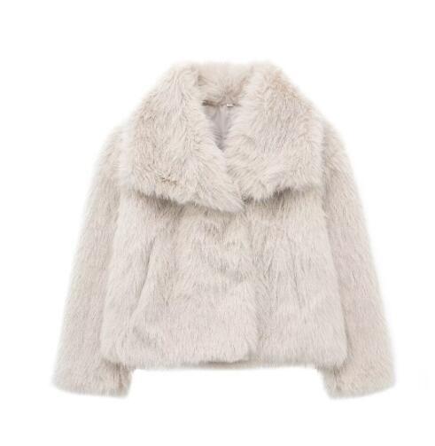Woman in cropped fluffy faux fur jacket