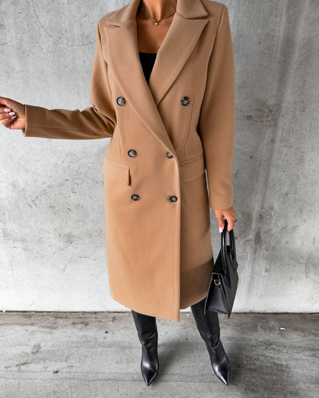 Woman in long double-breasted coat