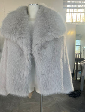 Woman in cropped fluffy faux fur jacket