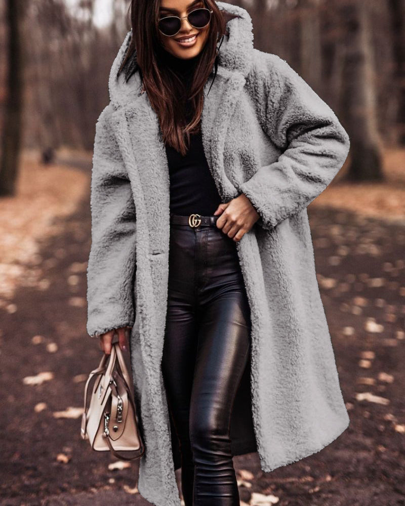 Woman in long hooded teddy coat