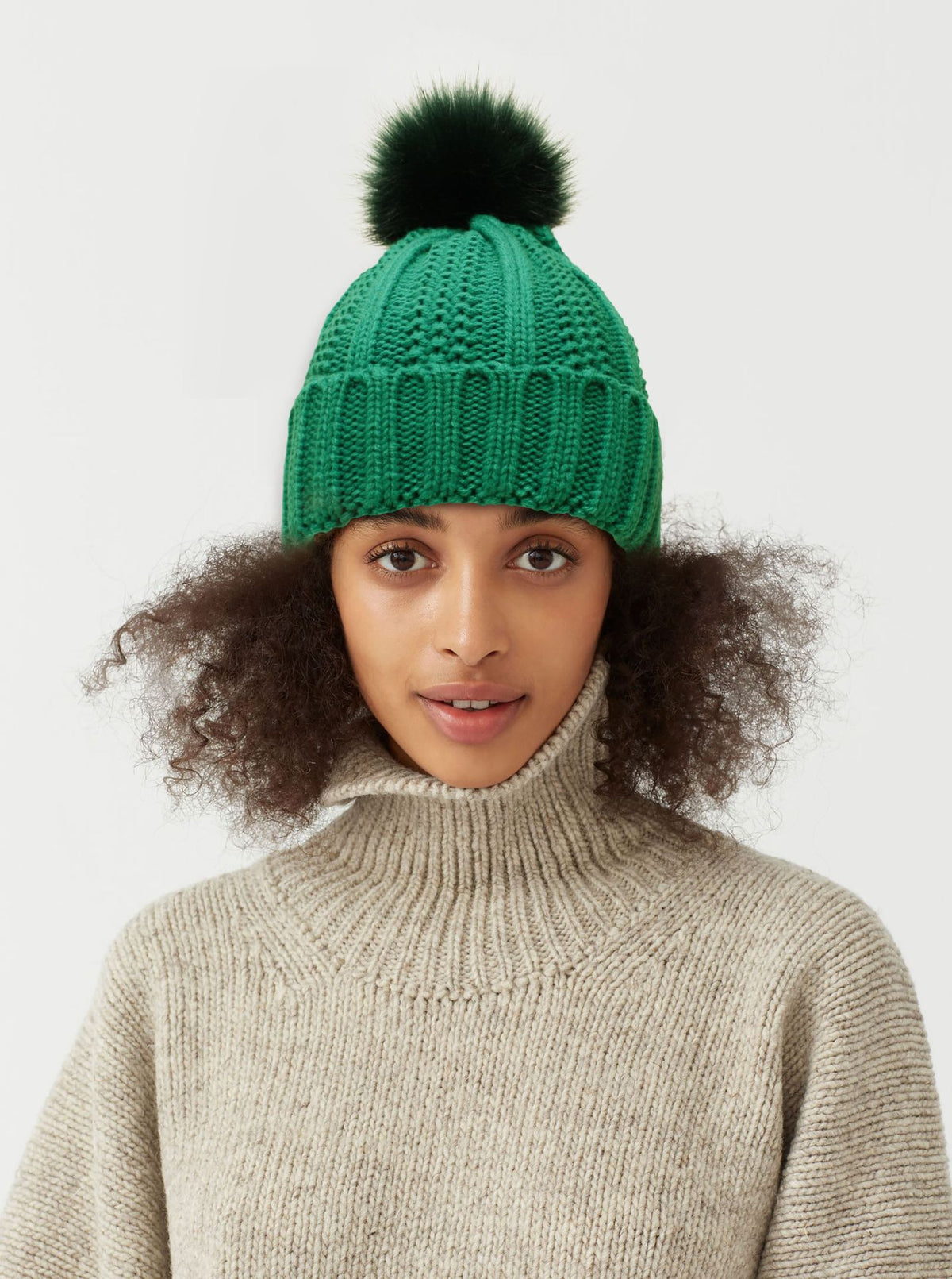 Knit beanie with faux fur pom pom